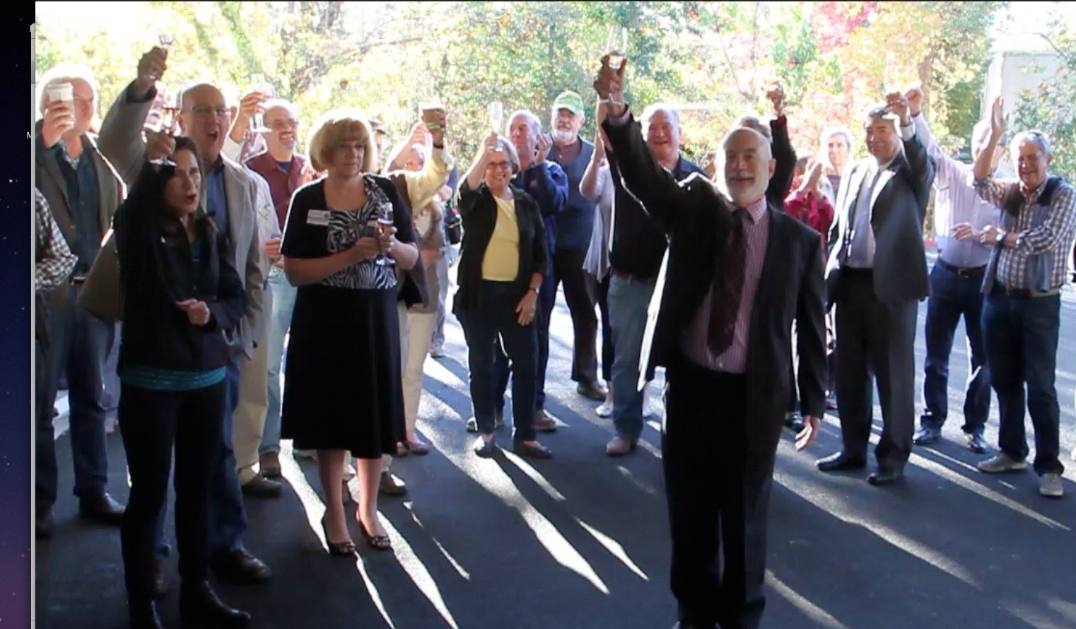 Palm Drive District Board Chair Jim Maresca, surrounded by hopsital supporters, leads opening toast